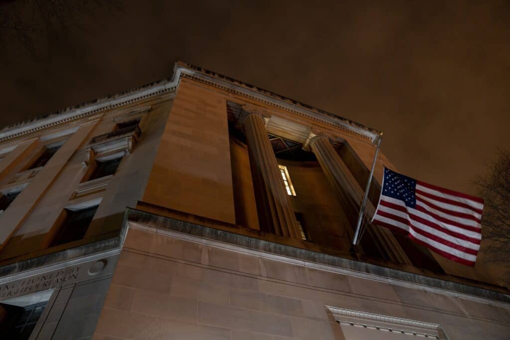 American flag outside DOJ building