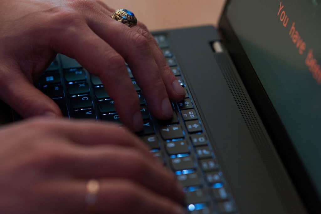 Fingers typing on keyboard