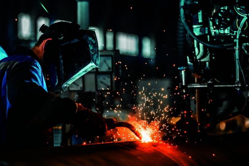 man welds at the factory