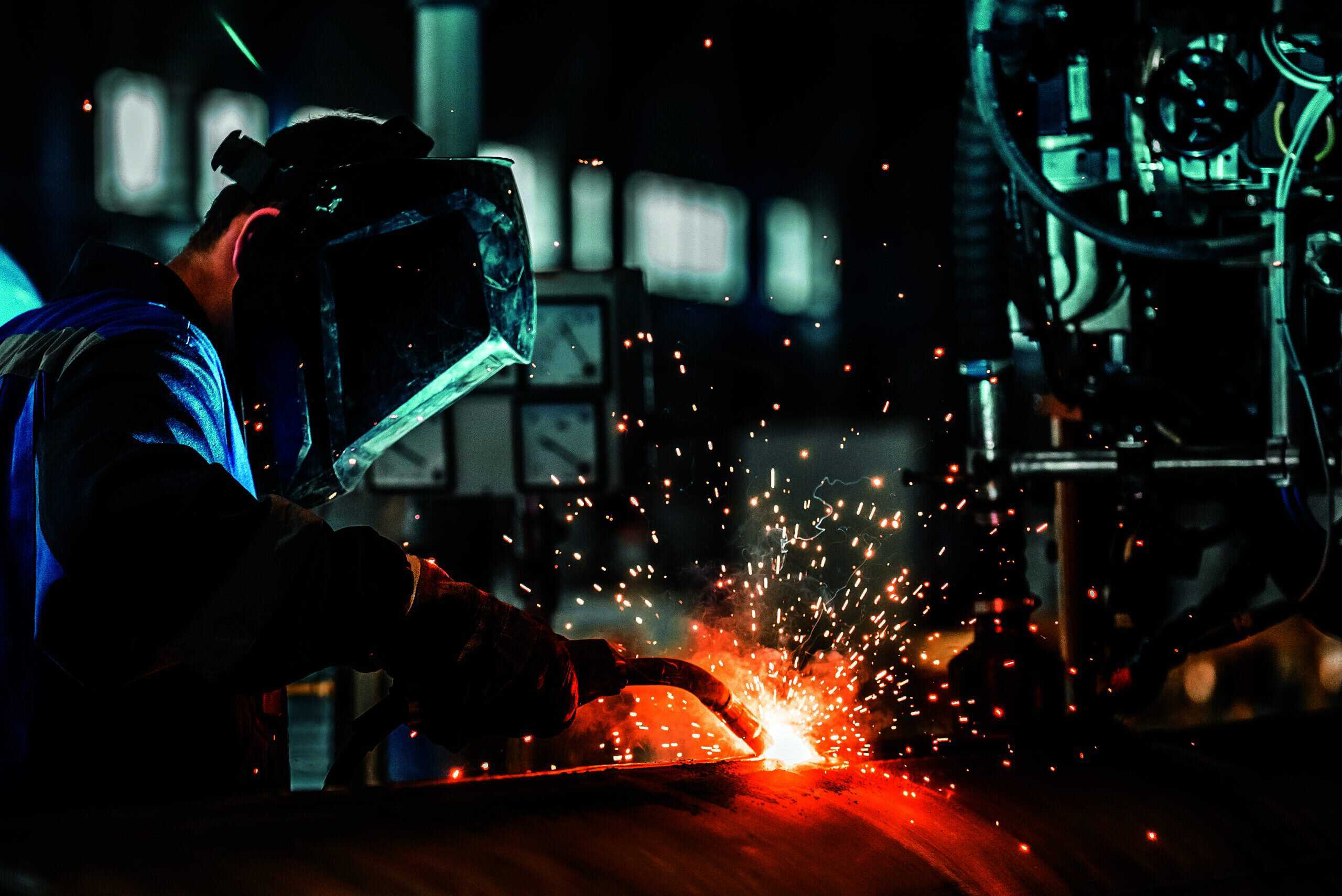 man welds at the factory