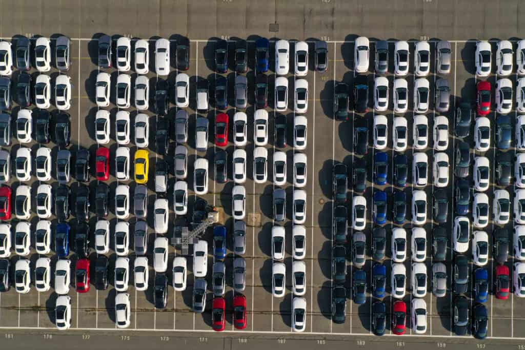 Aerial view of new cars at a seaport storage area