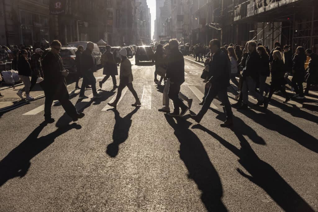 Shoppers walk along Broadway in NY