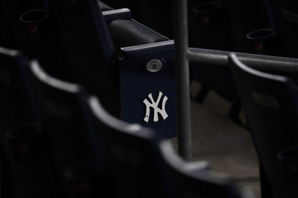 The New York Yankees logo on empty stadium seats