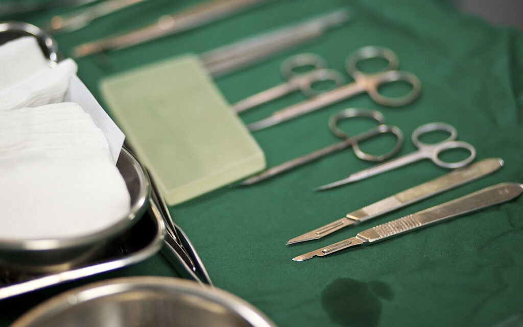 Surgical implements are laid out in preparation for operation