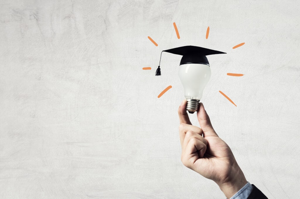 glowing light bulb with graduation hat