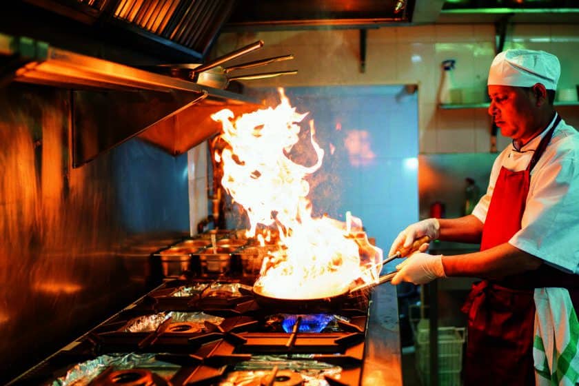 chef cooking in industrial kitchen