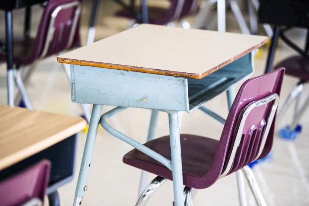 A student's desk at a Catholic elementary school
