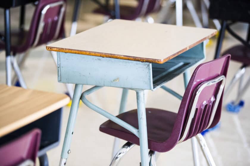 A student's desk at a Catholic elementary school