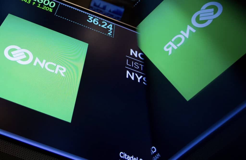 A monitor displays NCR Corp. signage on the floor of the NYSE