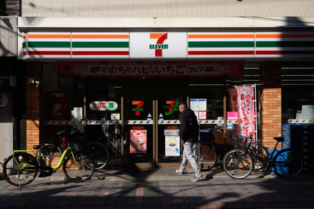 A customer enters a 7-eleven convenience store
