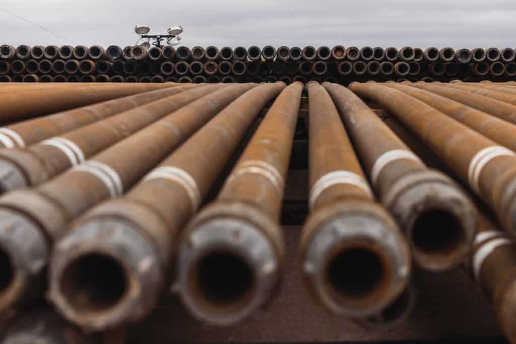 Stacks of steel pipes used for drilling oil wells
