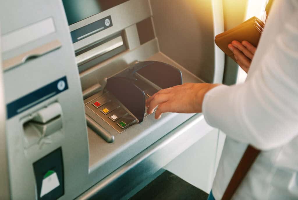 Woman using ATM