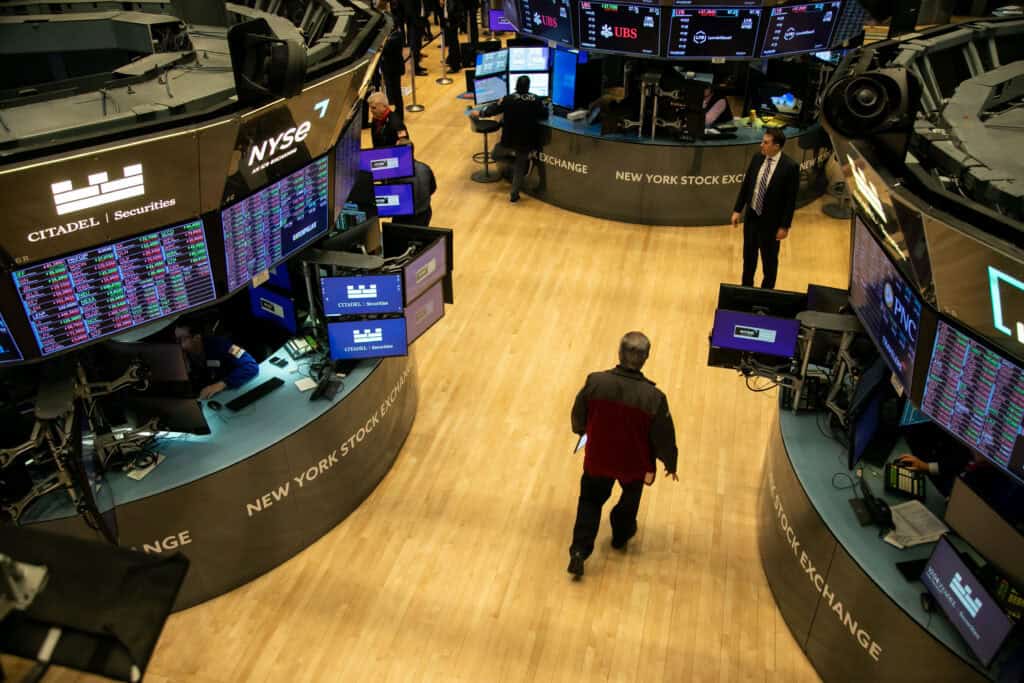 Traders work on the floor of the New York Stock Exchange
