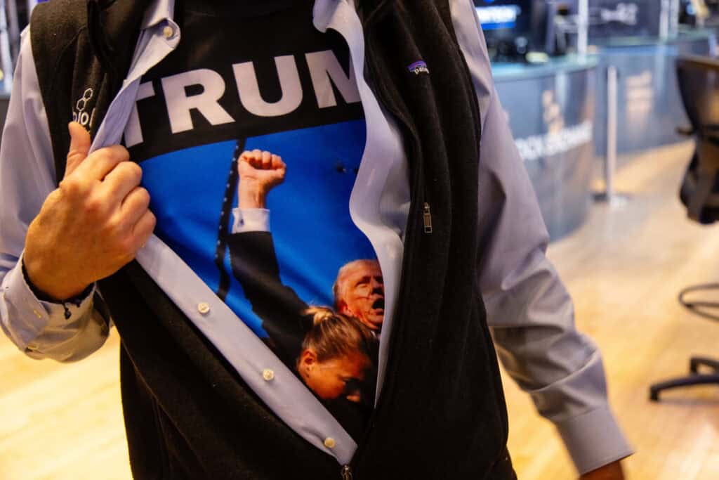A trader wearing a Trump shirt on the floor of the New York Stock Exchange (NYSE) in New York, US, on Wednesday, Nov. 6, 2024. Donald Trump quickly put his stamp on financial markets as his victory in the US presidential election propelled "Trump Trade" plays across assets